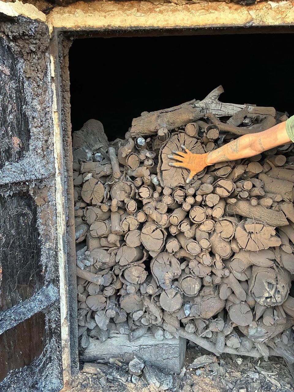 Traditional kiln with stacked encina charcoal